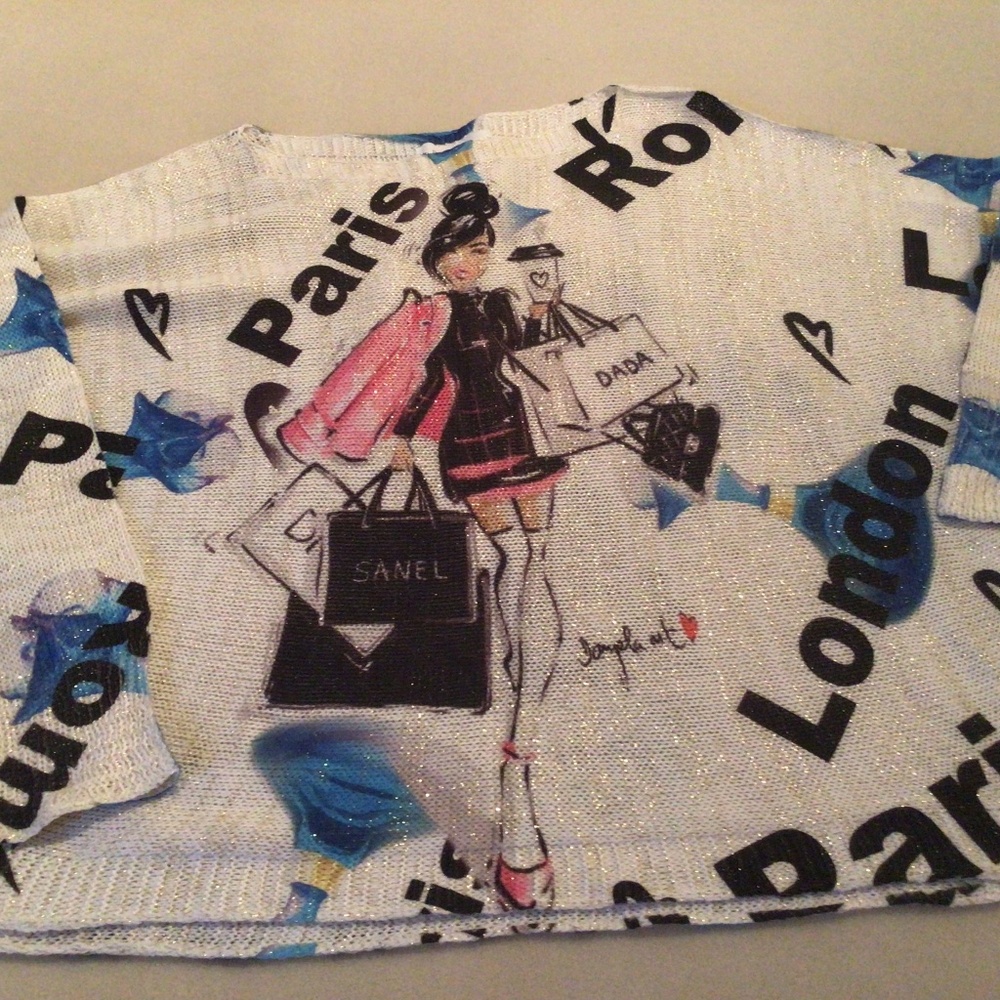 Beautiful sweater with travel logos and metallic threads.  EUC. Worn once.